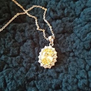 Pale yellow rhinestone halo pendant